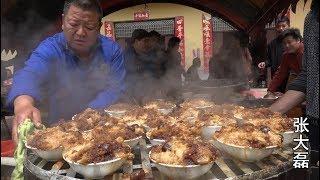 The wedding banquet in the mountains in the countryside, the large iron pot with open firewood