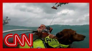 Helmet cam video shows dramatic rescue of dog and man during Hurricane Helene