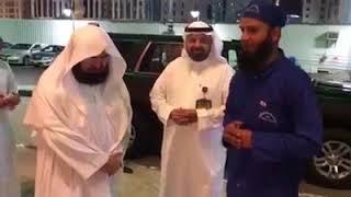 A Pakistani Haram worker imitates in the style of Sheikh Sudais in front of him