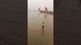 Aircraft marshal dancing. Toronto Pearson airport.