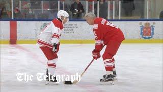 Russian President Putin and Belarusian President Lukashenko play ice hockey on the same team