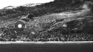 Shells explode on the coast of Guam in the Pacific Ocean. HD Stock Footage