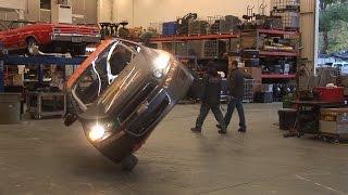 Incredible Stunt Driving...Car Drives on Two Wheels Thru a Shop !