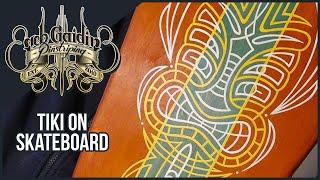 Pinstriping Tiki on skateboard