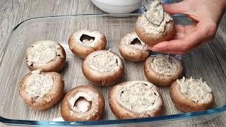 Stuffed champignons baked in the oven with cheese. Mushrooms in the oven.