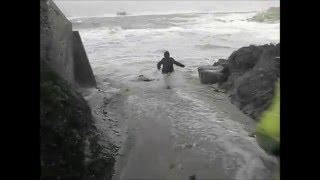 Elderly couple almost swept out to sea.