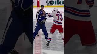 Matt Rempe & Ryan Reaves throwing punches at center ice 