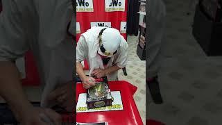 The legendary  Sabu  autographing  my action figure!