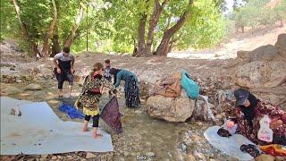 A good day with the family by the water: washing blankets and having fun