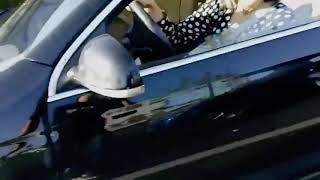 Women drives over man’s hand (car crush)