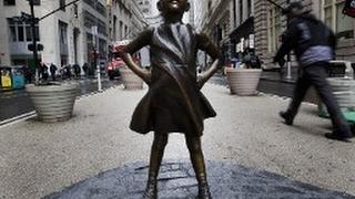 Young Girl Statue Faces Against The Wall Street Bull