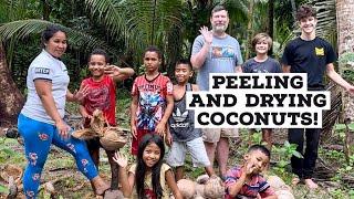 Traveling family peeling/drying coconuts on property of Airbnb with locals in the Philippines