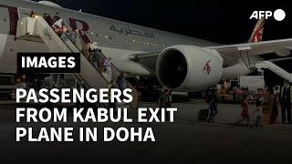 Passengers from first Kabul flight since US exit disembark in Doha | AFP