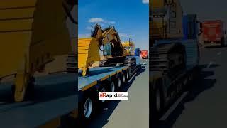 Excavator in Action! Unveiling Lowboy Trailer Shipping Secrets!