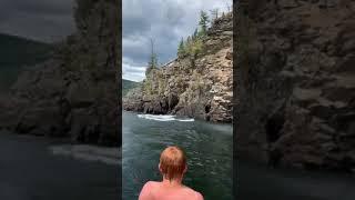 Guy Back Flops into Lake After Diving From Cliff - 1064316