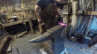 Blacksmithing primmer punching the eye