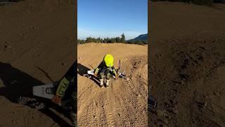 learning to pick up his dirt bike by himself