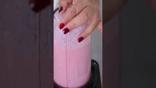 Preparation of strawberry smoothie bowl.