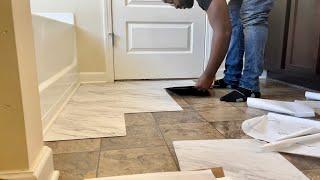 DIY BATHROOM FLOOR WITH PEEL & STICK MARBLE VINYL TILES.