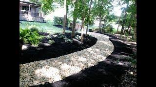 Installing river rock to solve some landscape problems