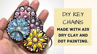 DIY keychains made with air dry clay. Dot painting on handmade keyrings.