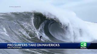 Pro surfers take on Mavericks during winter swell. Waves reach 60 feet