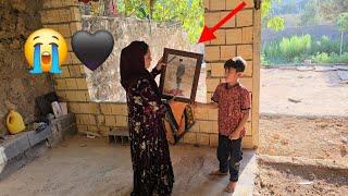 Preparation of a photo frame for Ibrahim's photo and a black dress for Ibrahim's mourning