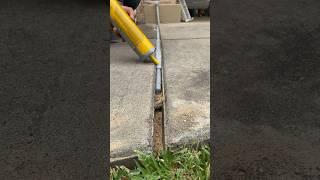 Part 2 of 3: using Sikaflex to repair expansion joints #diy #howto #drivewayrepair #homerenovation