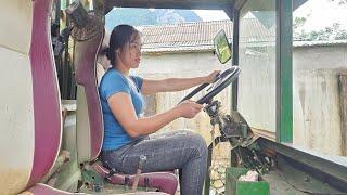 the girl and the driver Driving a homemade truck carrying bamboo.