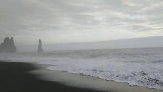 Reynisfjara black sand beach at sunset. Vik, Iceland