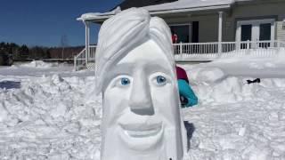 Time lapse of snow sculpture creation.  Including painted wood eyes.