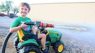 Playing with a firehose on the farm with tractors | Tractors for kids