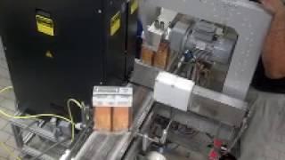 N3400V Automatic Side Seal Strapping Machine Installed in a Packaging Industry