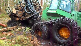 Forwarder John Deere 1110D in deep mud, extreme offroad