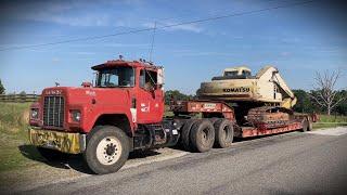 1986 Mack R Model 300 with a 5 Speed Hauling a pc200 Komatsu