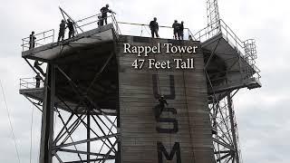 Recruits with Oscar Company, 4th Recruit Training Battalion, face the rappel tower to overcome