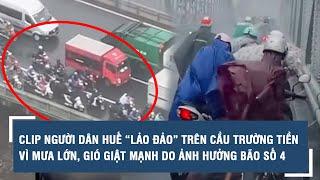 Clip người dân Huế “lảo đảo” trên cầu Trường Tiền vì mưa lớn, gió giật mạnh do ảnh hưởng bão số 4