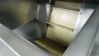 Inclined cleated bottle elevator by New England Machinery