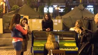 Girls playing the piano on the Maidan, Kiev, Ukraine