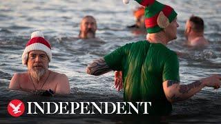 Swimmers enjoy Christmas Day dips across the UK