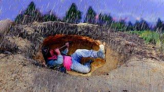 Camping alone building underground shelter in strong storm. Bushcraft. Camping in the rain