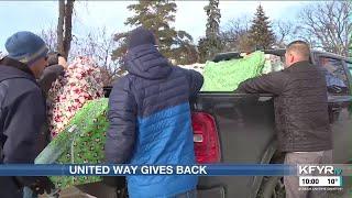 Volunteers deliver gifts to children in need