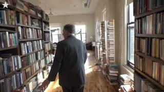 Floor to ceiling books fill Kemper's loft home