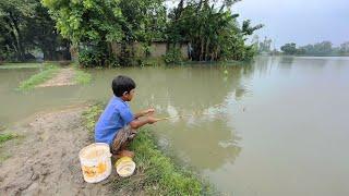 Fishing in Rainy Season Water ~ Village Little Boy Catching Fish With Hook in Village Field Fishing