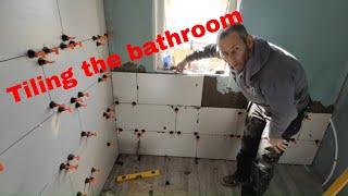 Tiling the bathroom floor and walls