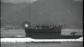 Japanese submarine surfaces in a bay, in Japan, in World War II. HD Stock Footage