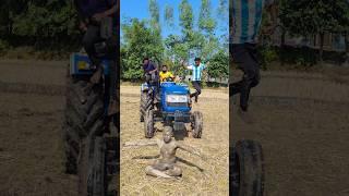 Statue in front of tractor