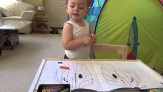 playing with crayons at 25 months