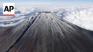 Snow finally arrives at Japan's Mount Fuji after the longest wait in 130 years