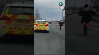 Police criticised for not pulling over motorbike rider doing wheelies next to them #itvnews #news